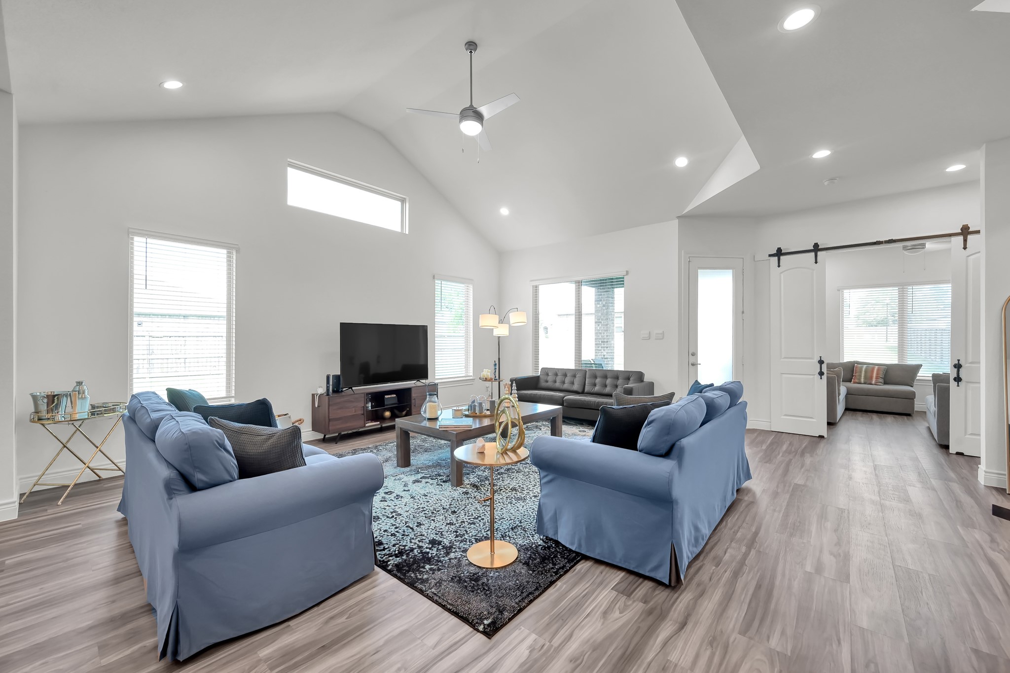 12250 Seagrape Lane Conroe, TX 77304 - Photo 10 of 19 a living room with furniture and a flat screen tv