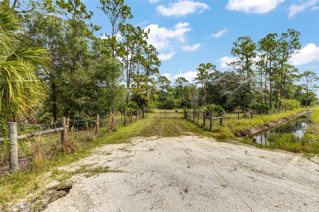 2201 Riviera Avenue Clewiston, FL 33440 - Photo 2 of 31 a view of swimming pool with a yard