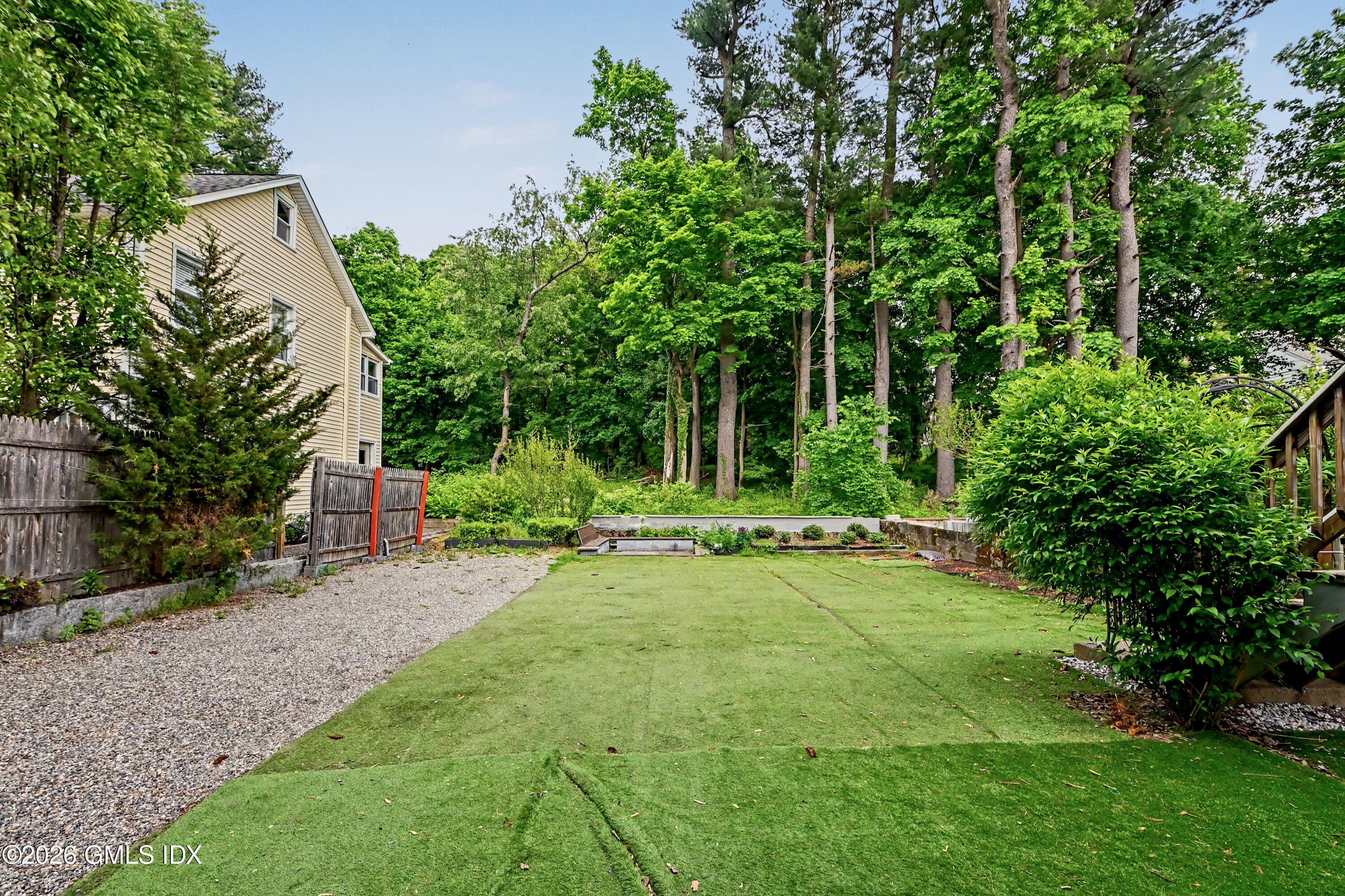 37 Prospect Street Greenwich, CT 06830 - Photo 31 of 41 a view of a backyard with sitting area and garden