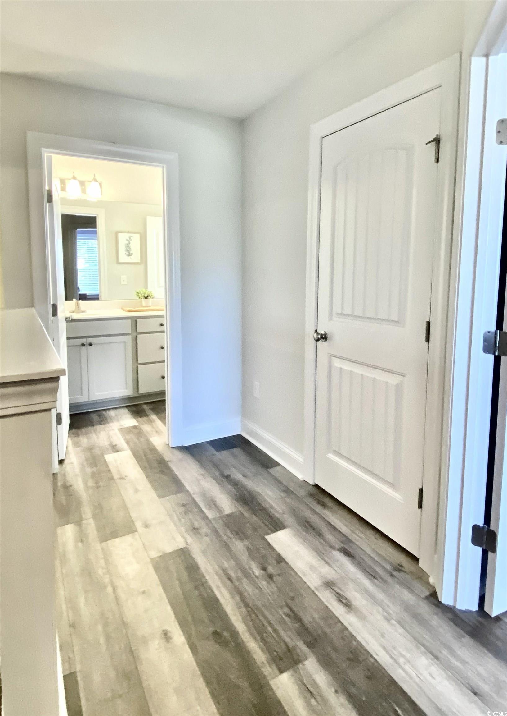 2664 Seaport Circle Georgetown, SC 29440 - Photo 25 of 40 Unfurnished bedroom with ensuite bath and light wood-type flooring