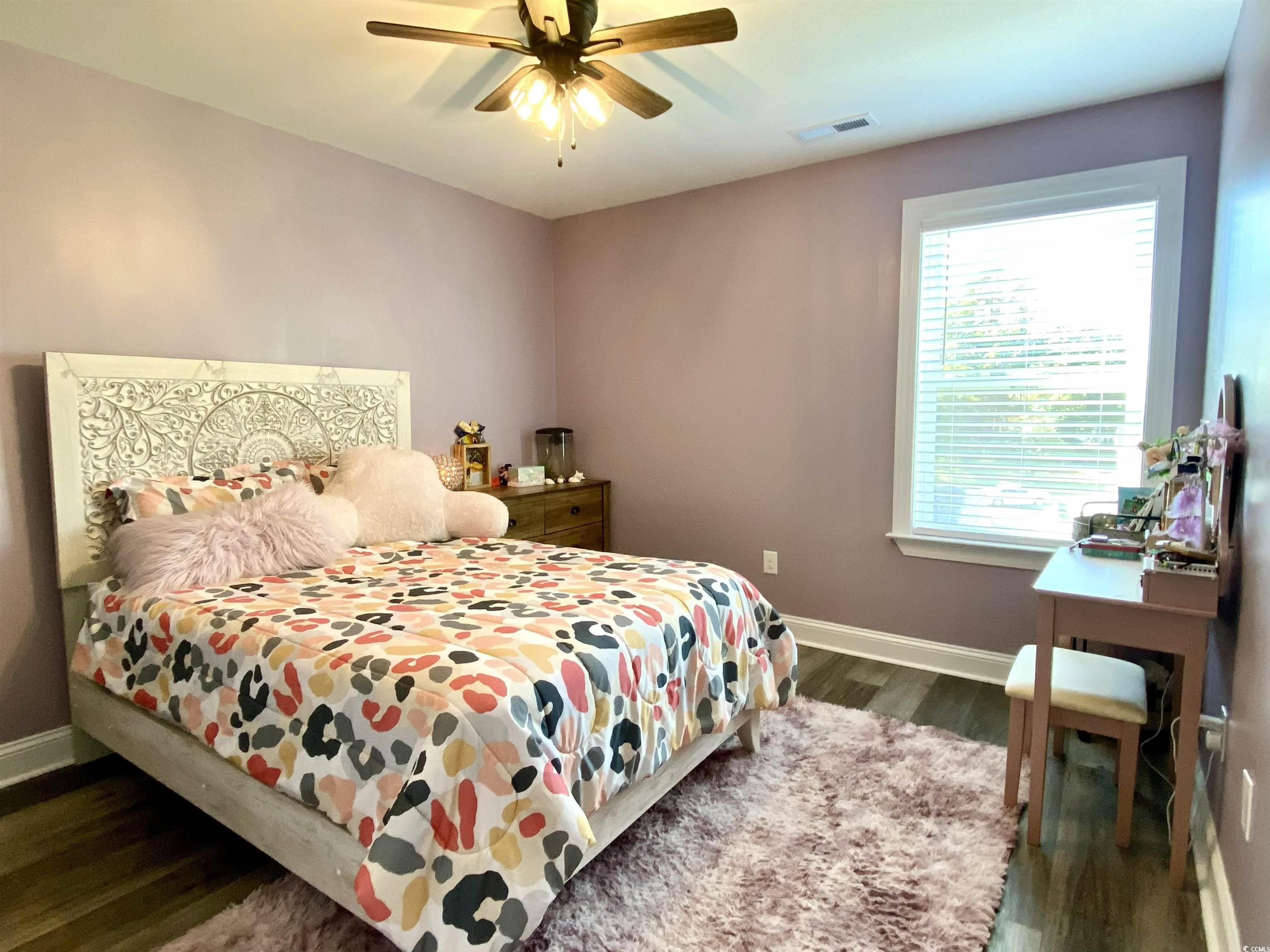 2664 Seaport Circle Georgetown, SC 29440 - Photo 27 of 40 Bedroom featuring dark wood-style floors and a ceiling fan