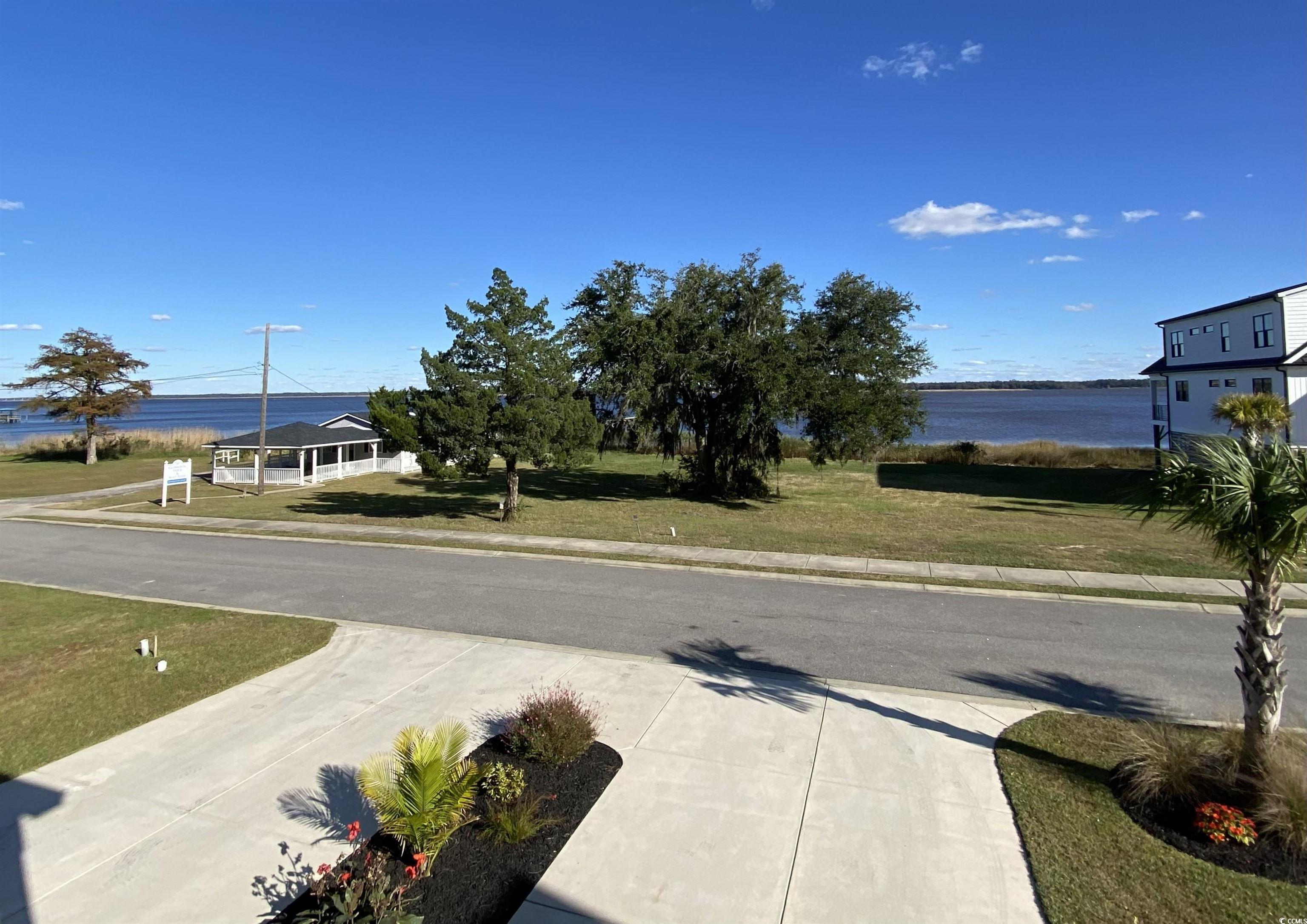 2664 Seaport Circle Georgetown, SC 29440 - Photo 5 of 40 View of road with sidewalks, a water view, and curbs