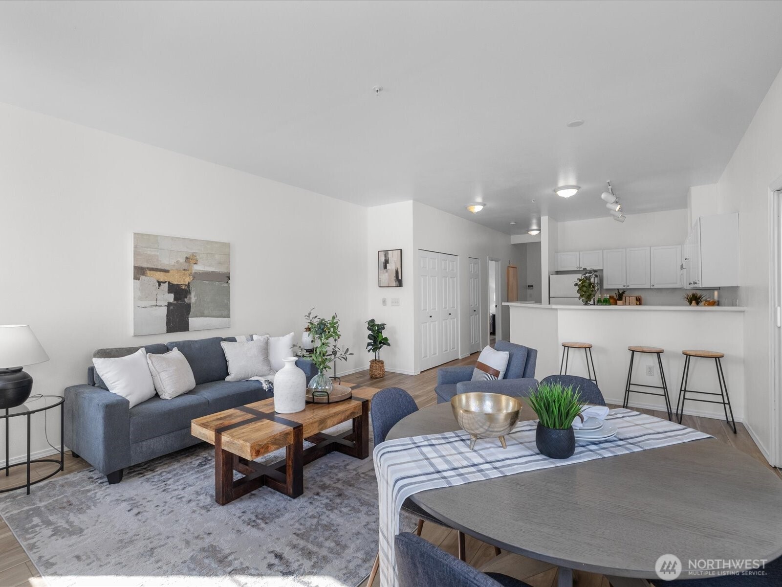 17426 Bothell Way Northeast, Unit A407 Bothell, WA 98011 - Photo 13 of 36 a living room with furniture kitchen and a potted plant