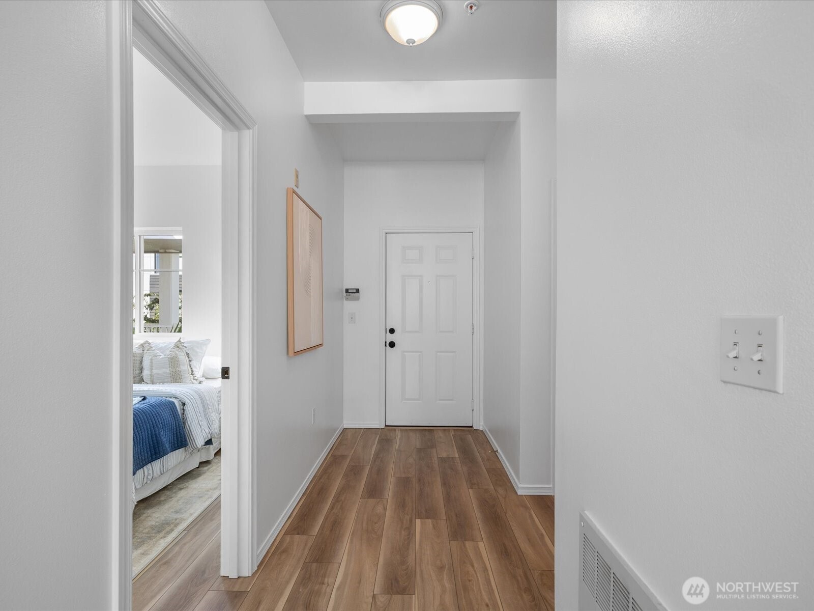 17426 Bothell Way Northeast, Unit A407 Bothell, WA 98011 - Photo 20 of 36 a view of a bedroom from a hallway