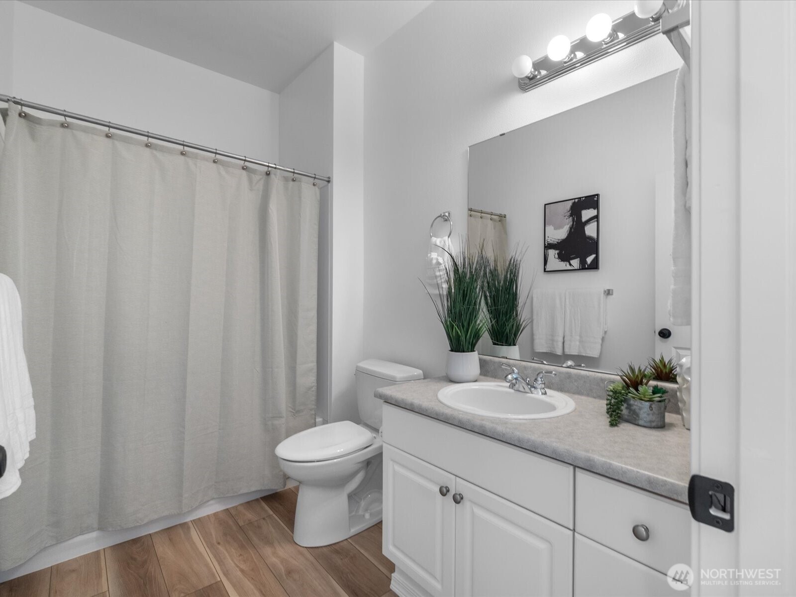 17426 Bothell Way Northeast, Unit A407 Bothell, WA 98011 - Photo 22 of 36 a bathroom with a granite countertop sink toilet and shower