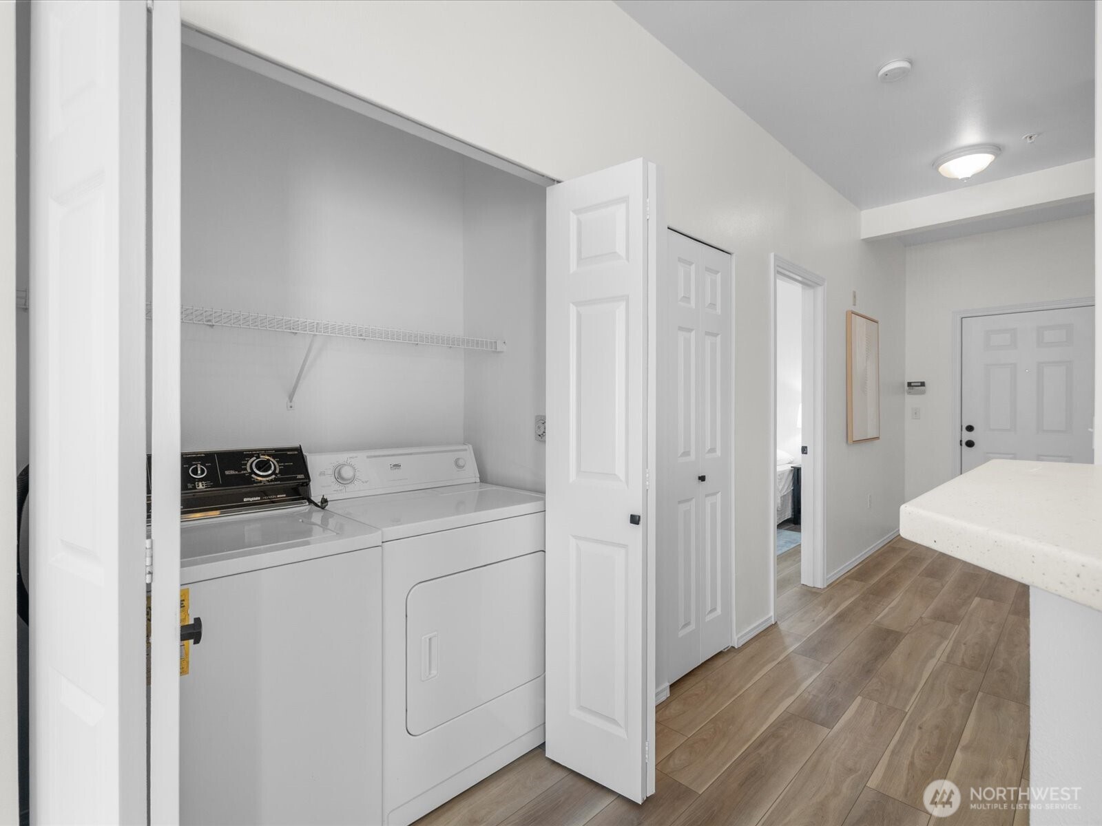 17426 Bothell Way Northeast, Unit A407 Bothell, WA 98011 - Photo 23 of 36 a utility room with cabinets washer and dryer