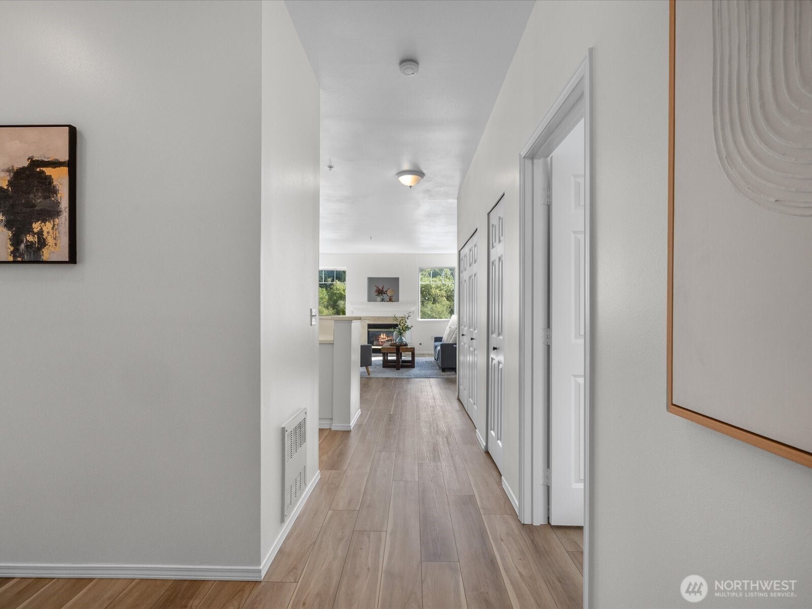 17426 Bothell Way Northeast, Unit A407 Bothell, WA 98011 - Photo 4 of 36 a view of a hallway with wooden floor fireplace and living room
