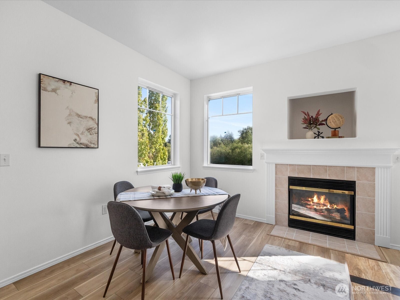 17426 Bothell Way Northeast, Unit A407 Bothell, WA 98011 - Photo 10 of 36 a dining room with furniture and a fireplace