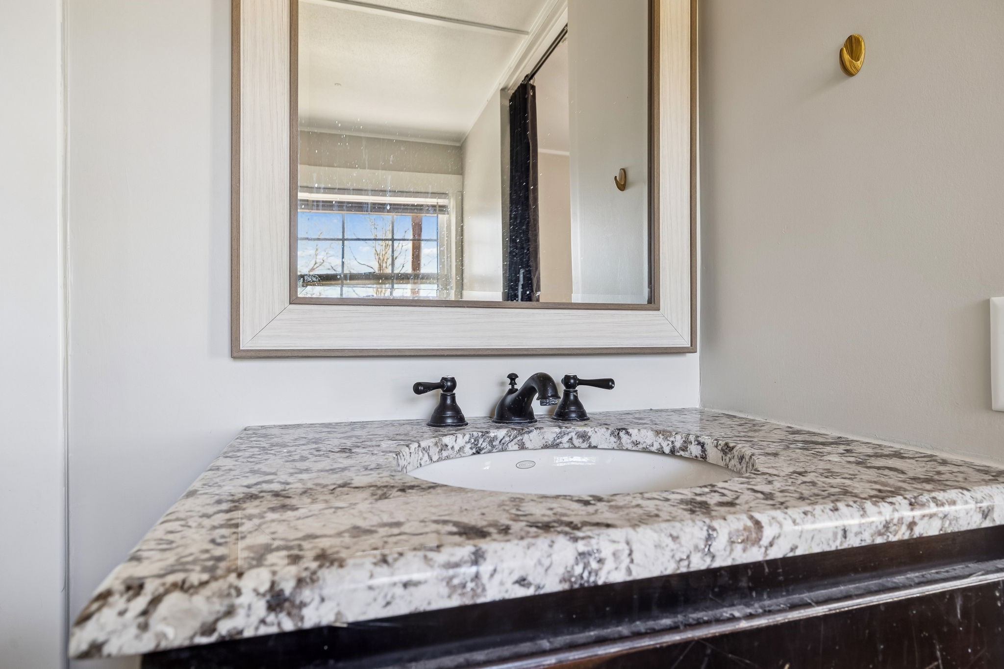 1053 Pack Road White Bluff, TN 37187 - Photo 26 of 47 a bathroom with a granite countertop sink and a mirror