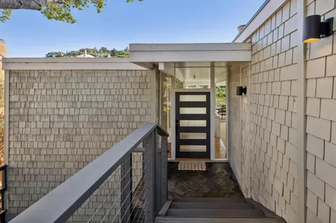 a view of outdoor space with wooden floor