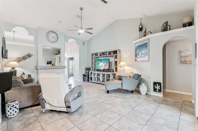 a living room with furniture and a clock