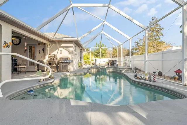 a view of a swimming pool with a patio