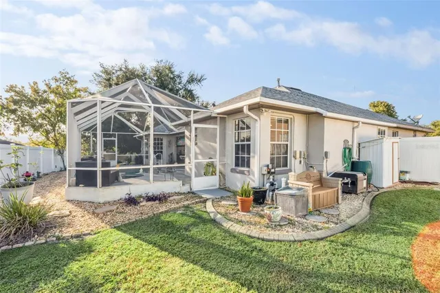 a front view of a house with a garden and patio