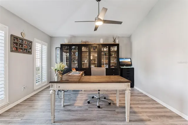 a view of a dining room with wooden floor