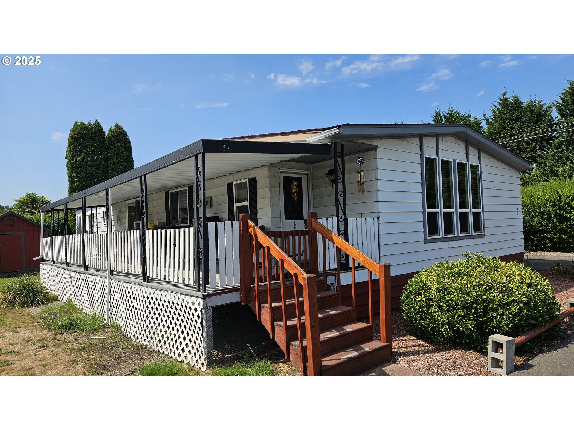 5600 Mt Solo Road Longview, WA 98632 - Photo 1 of 17 a view of a house with wooden fence