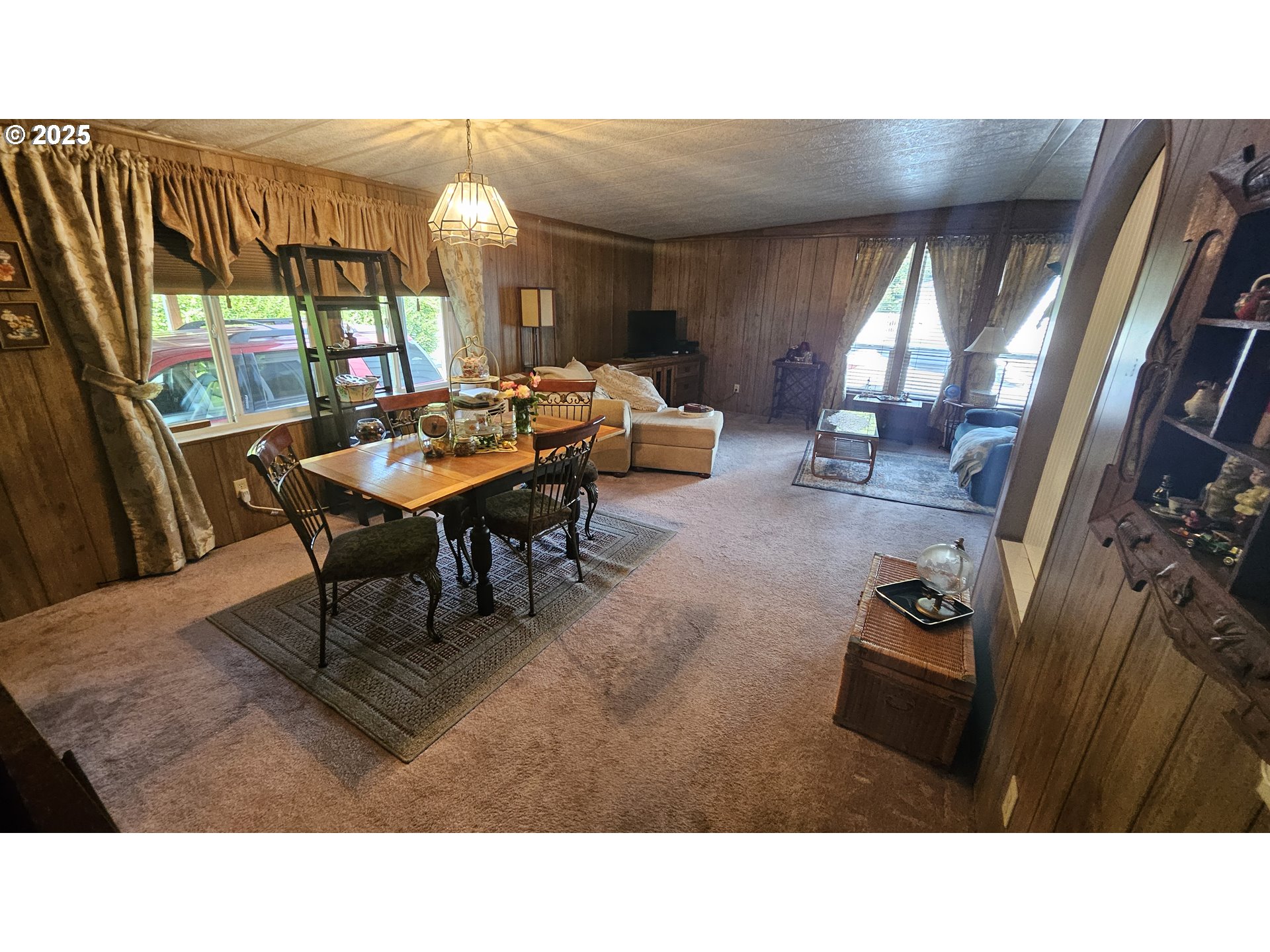 5600 Mt Solo Road Longview, WA 98632 - Photo 12 of 17 a living room with furniture and a floor to ceiling window