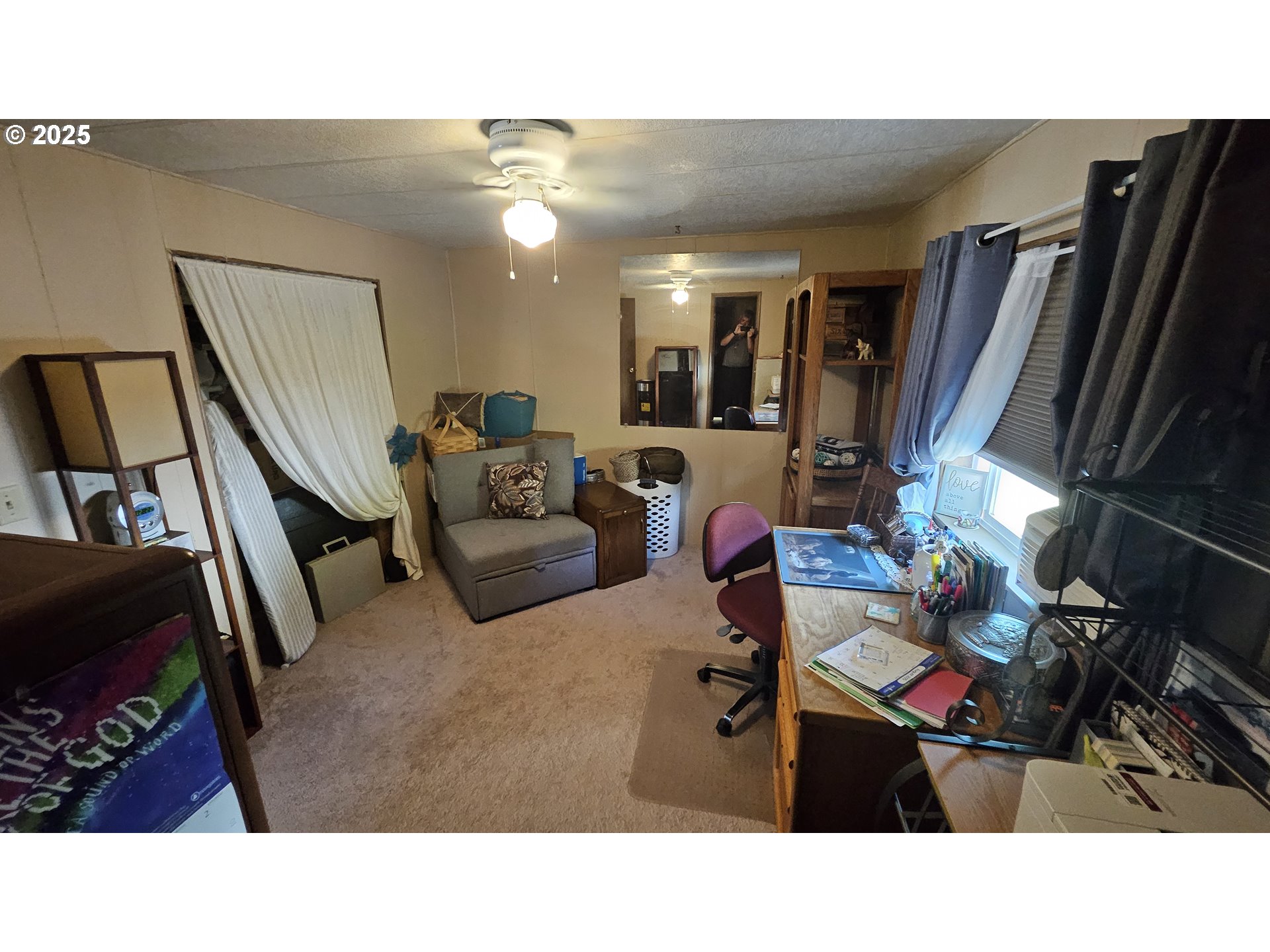 5600 Mt Solo Road Longview, WA 98632 - Photo 8 of 17 a living room with furniture a flat screen tv and a toilet