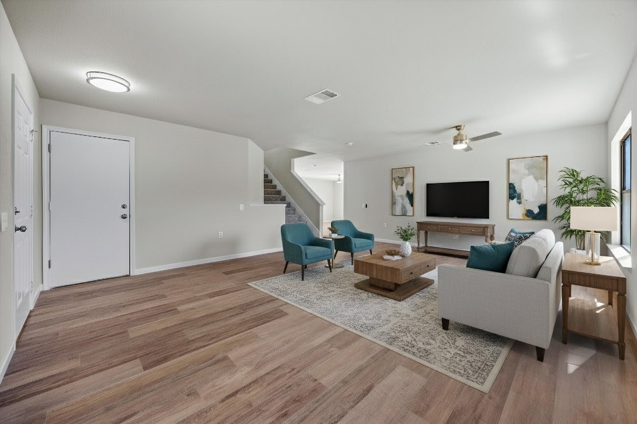 7541 Redrick Drive Austin, TX 78747 - Photo 10 of 40 Living area featuring stairs, light wood finished floors, and ceiling fan