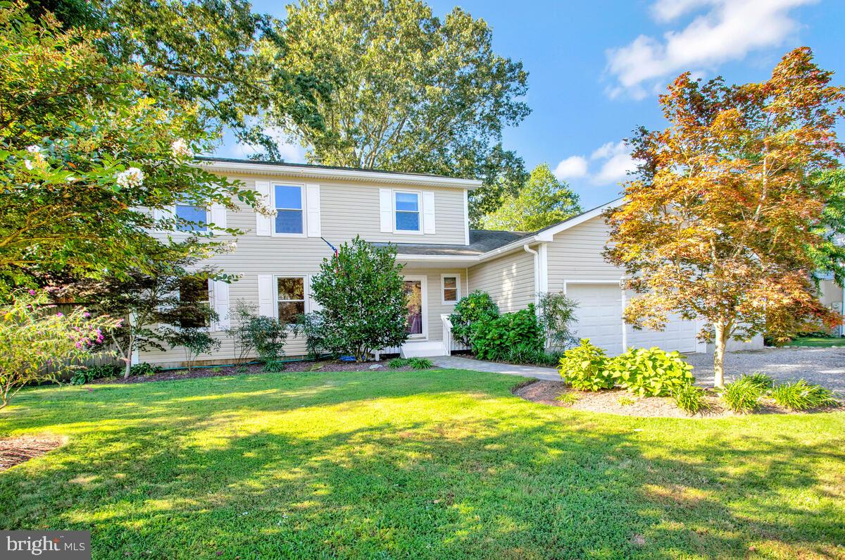 645 Gull Drive Deale, MD 20751 - Photo 10 of 41 a front view of a house with a yard