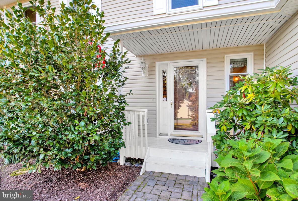 645 Gull Drive Deale, MD 20751 - Photo 13 of 41 a front view of a house with garden