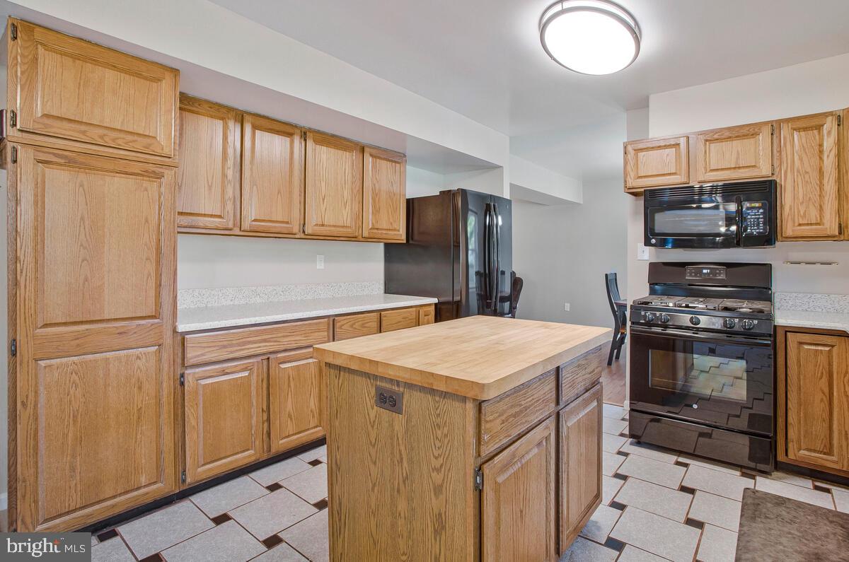 645 Gull Drive Deale, MD 20751 - Photo 16 of 41 a kitchen with stainless steel appliances a refrigerator sink and stove
