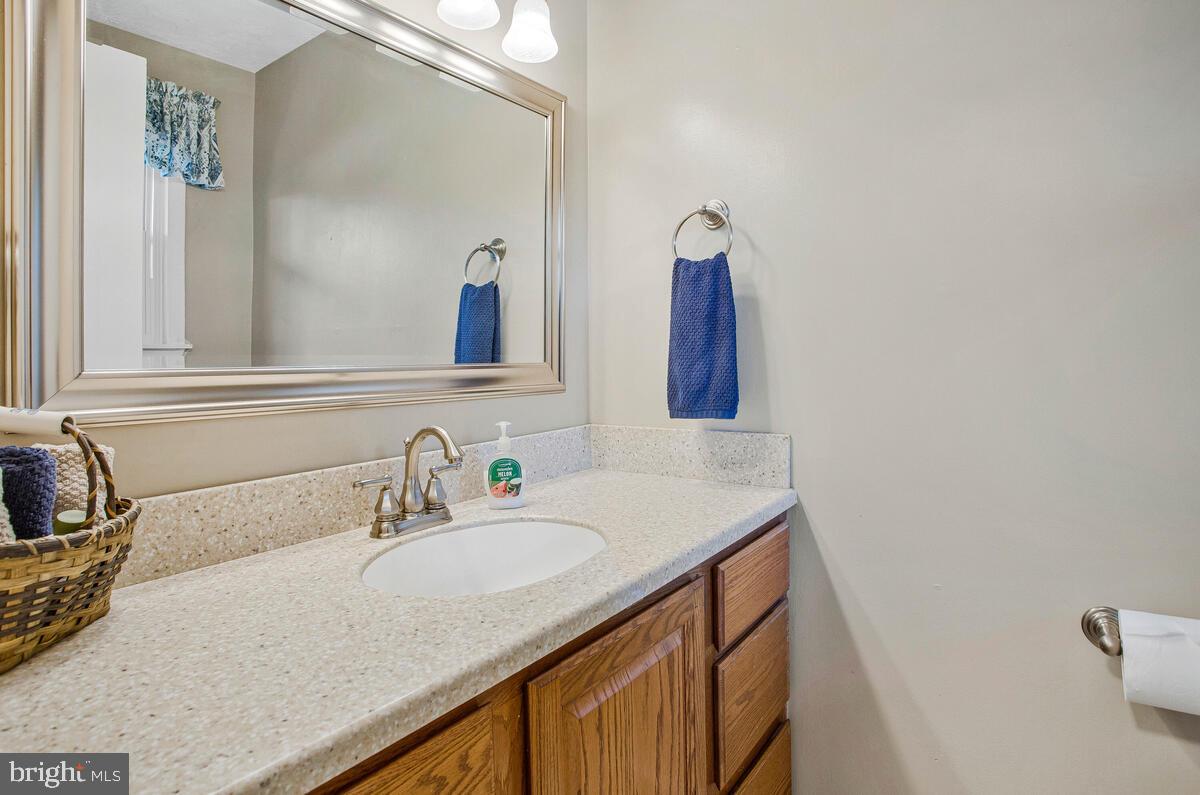 645 Gull Drive Deale, MD 20751 - Photo 22 of 41 a bathroom with a sink and a mirror
