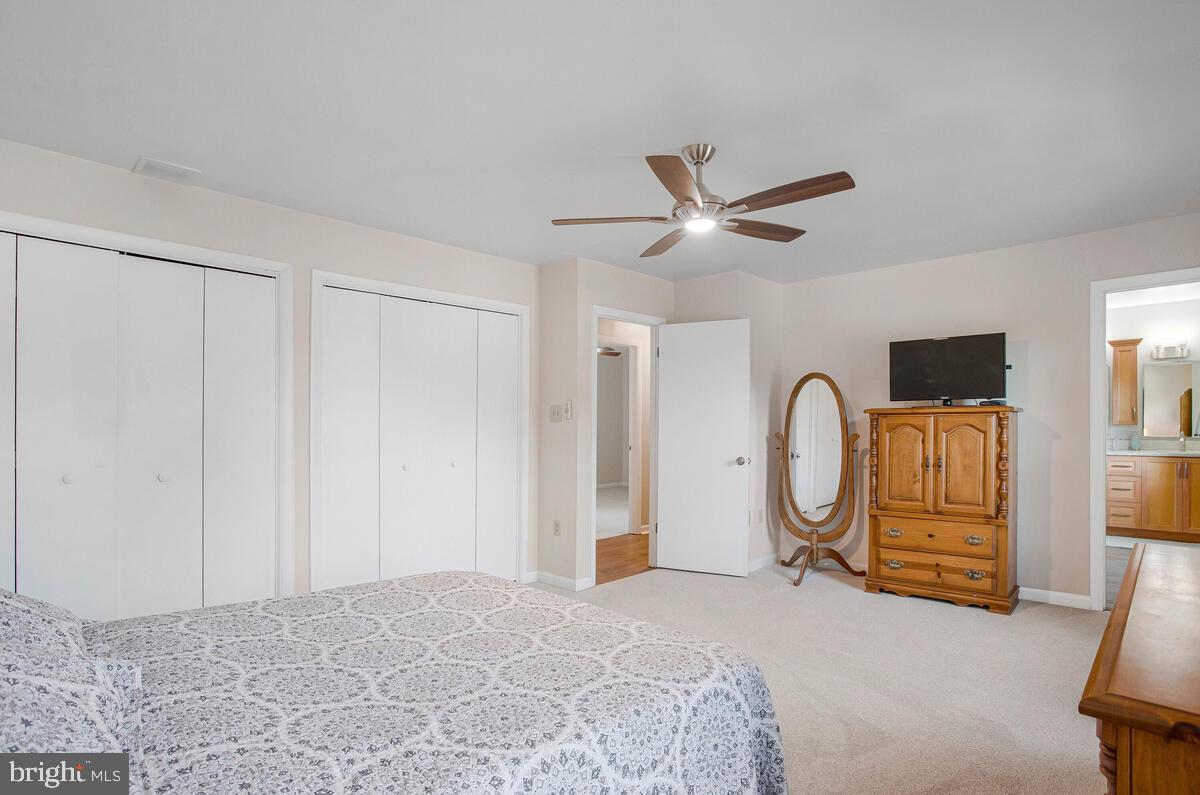 645 Gull Drive Deale, MD 20751 - Photo 24 of 41 a bedroom with furniture and a ceiling fan