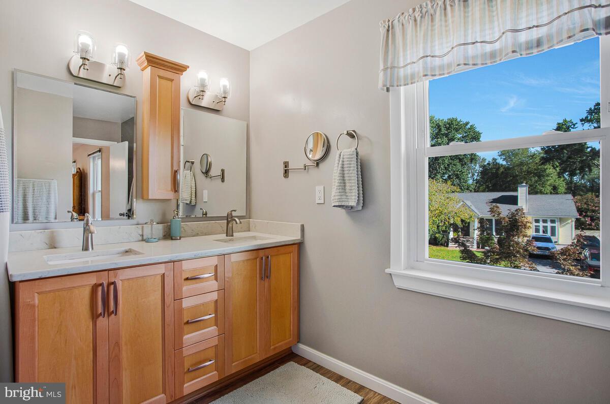 645 Gull Drive Deale, MD 20751 - Photo 26 of 41 a bathroom with a double vanity sink and a mirror