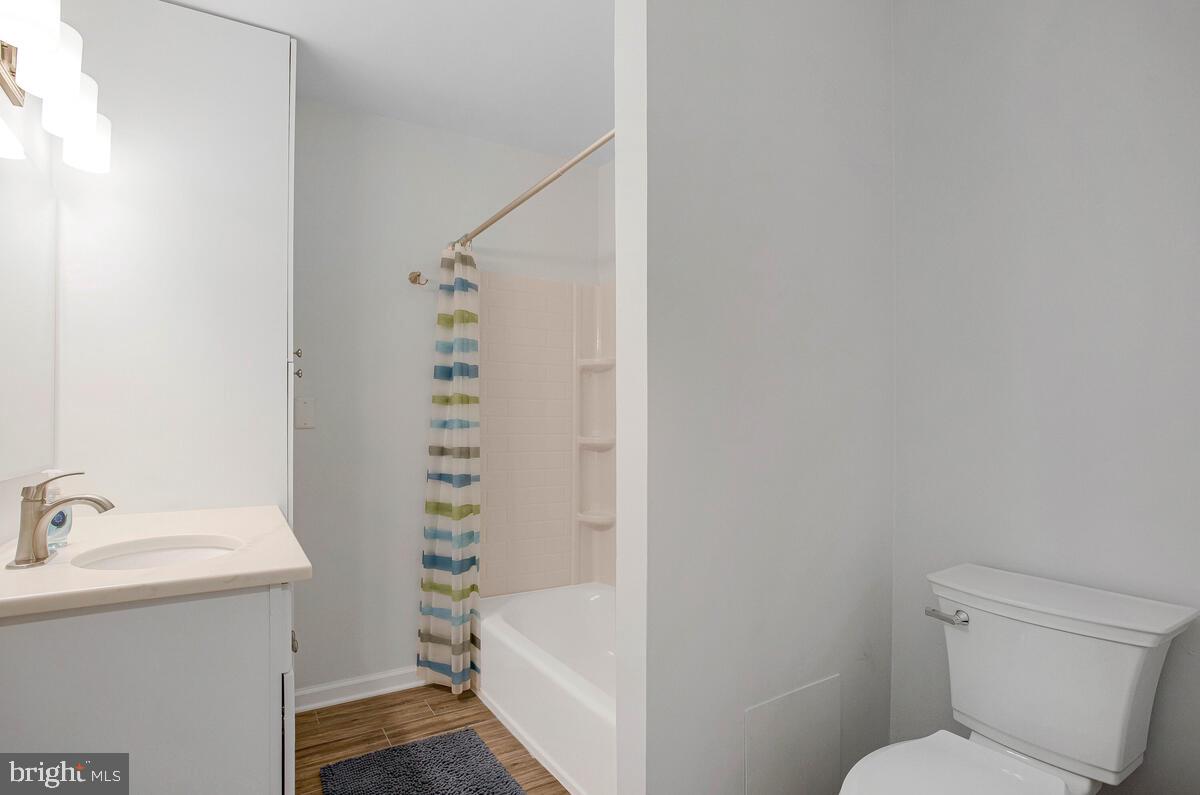 645 Gull Drive Deale, MD 20751 - Photo 31 of 41 a bathroom with a sink a toilet and shower