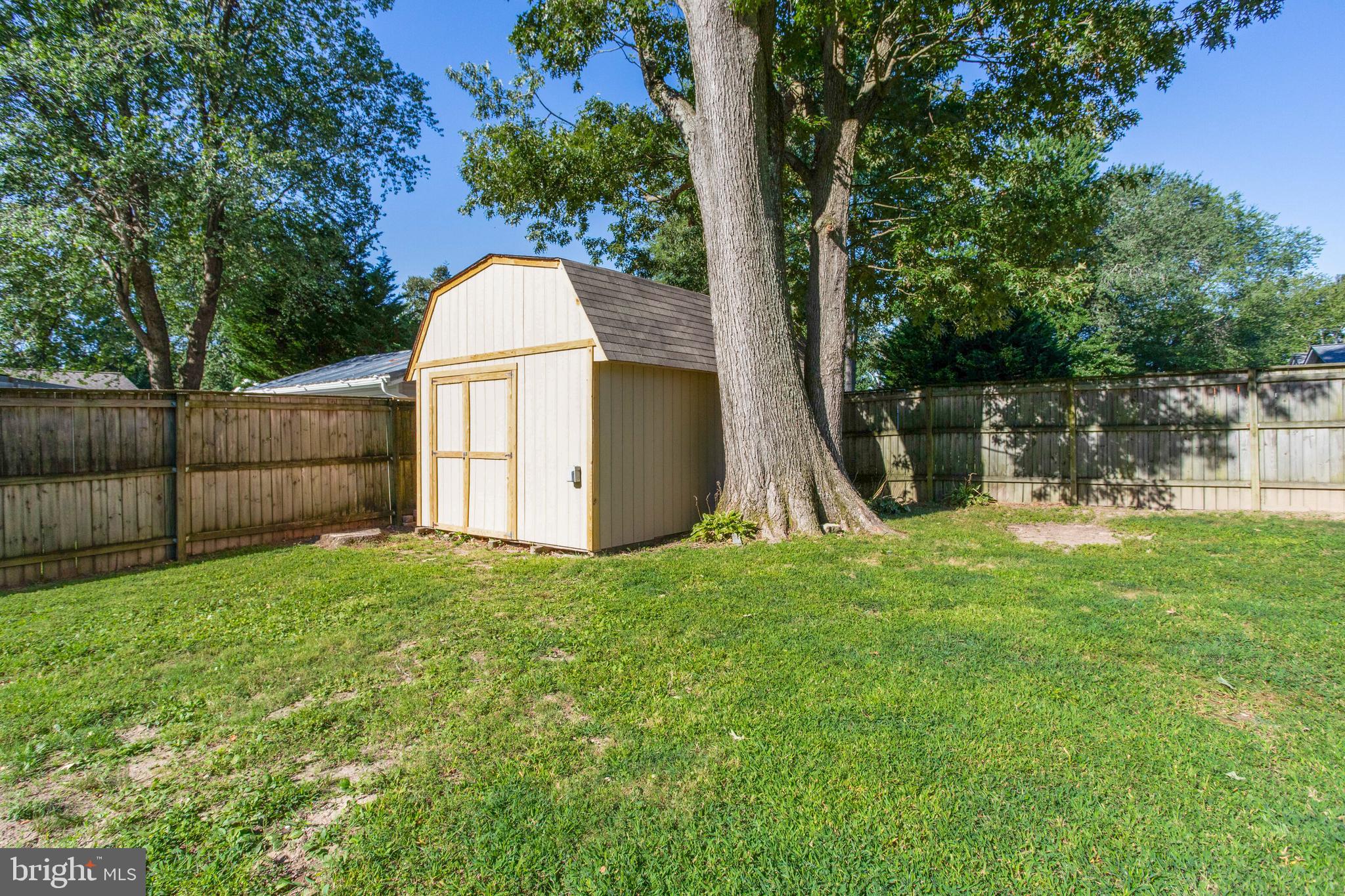 645 Gull Drive Deale, MD 20751 - Photo 38 of 41 a backyard of a house with lots of green space