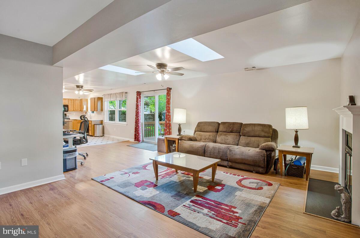 645 Gull Drive Deale, MD 20751 - Photo 6 of 41 a living room with furniture a rug and a table