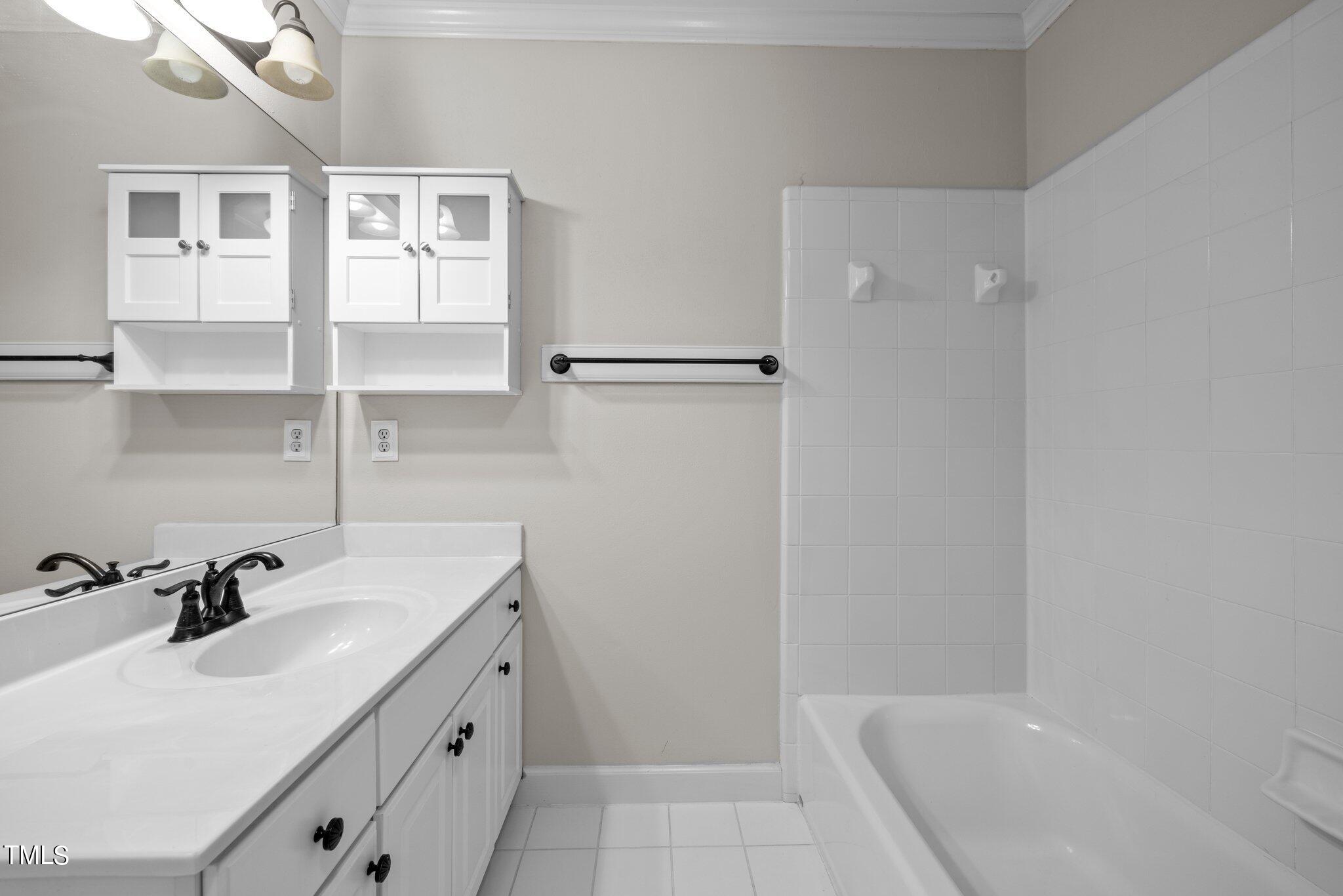 7621 Wilderness Road Raleigh, NC 27613 - Photo 40 of 60 Hall Bath with access to Bedroom 3