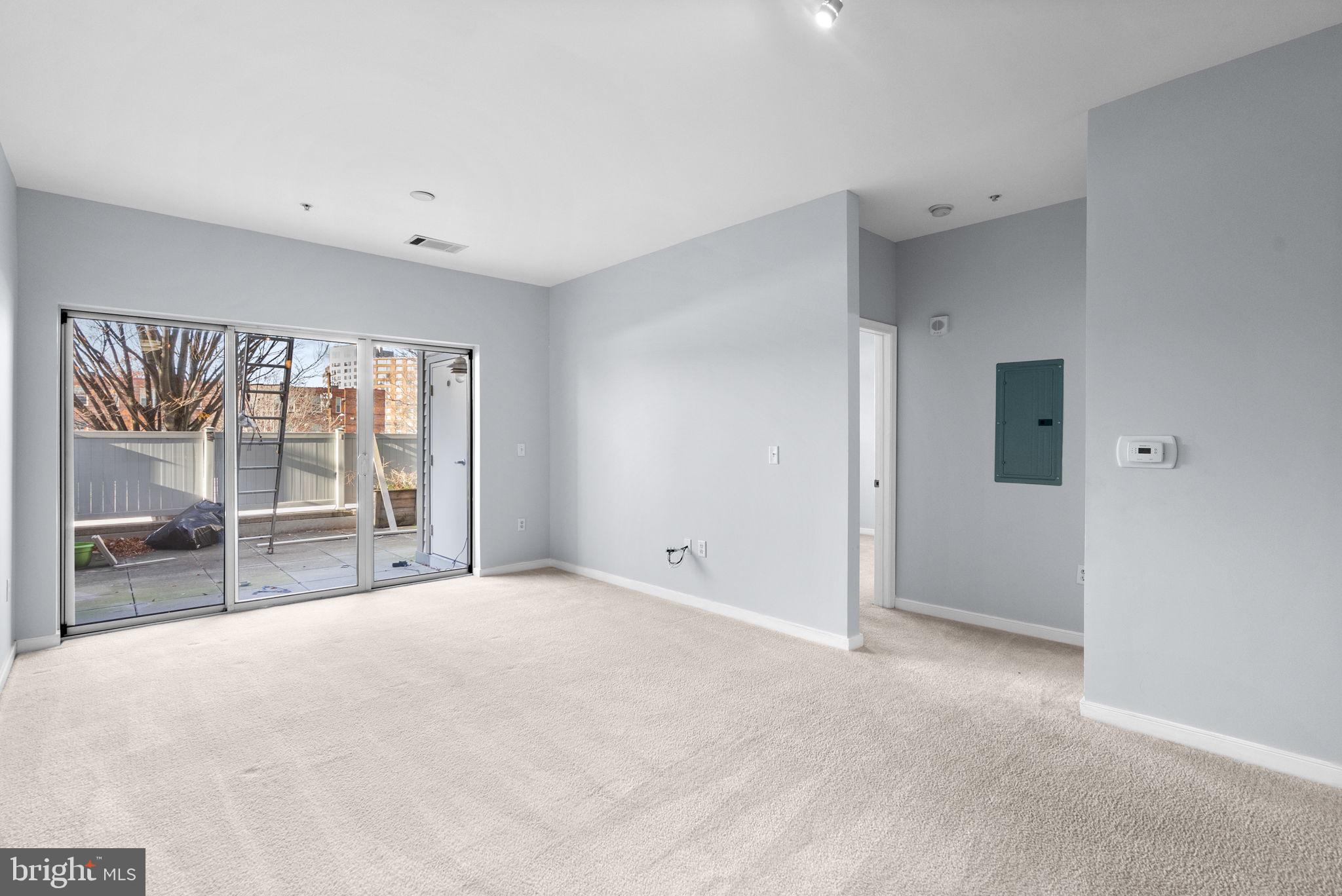 8045 Newell Street, Unit 116 Silver Spring, MD 20910 - Photo 11 of 28 a view of an empty room with a window