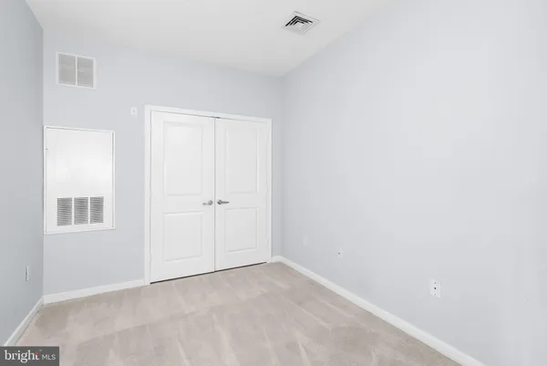 a view of small space with racks on the wall