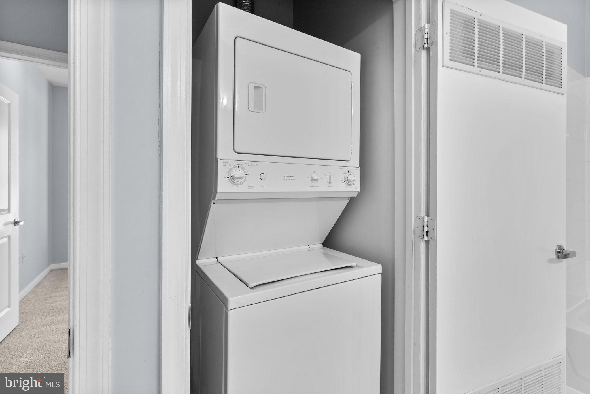 8045 Newell Street, Unit 116 Silver Spring, MD 20910 - Photo 18 of 28 a utility room with dryer and washer
