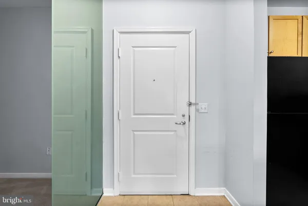 a kitchen with stainless steel appliances granite countertop a sink a refrigerator and a stove