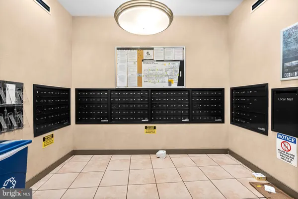 a view of a patio with couches and table and chairs and potted plants