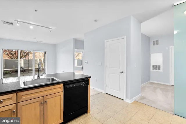 a view of a kitchen with a sink and a microwave