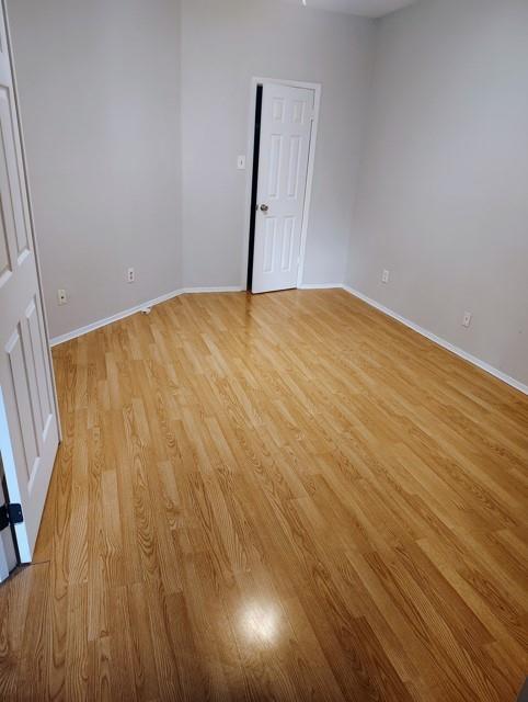 5550 Spring Valley Road, Unit D16 Dallas, TX 75254 - Photo 2 of 6 a view of an empty room with wooden floor