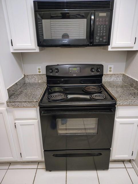 5550 Spring Valley Road, Unit D16 Dallas, TX 75254 - Photo 5 of 6 a stove top oven sitting inside of a kitchen