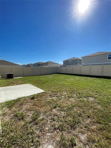 a view of a swimming pool and an outdoor space