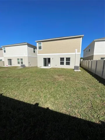 a view of a house with backyard