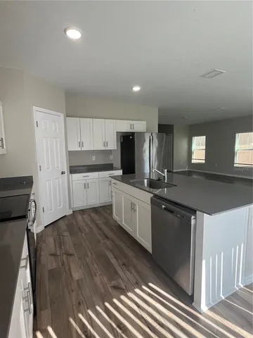 a large kitchen with cabinets