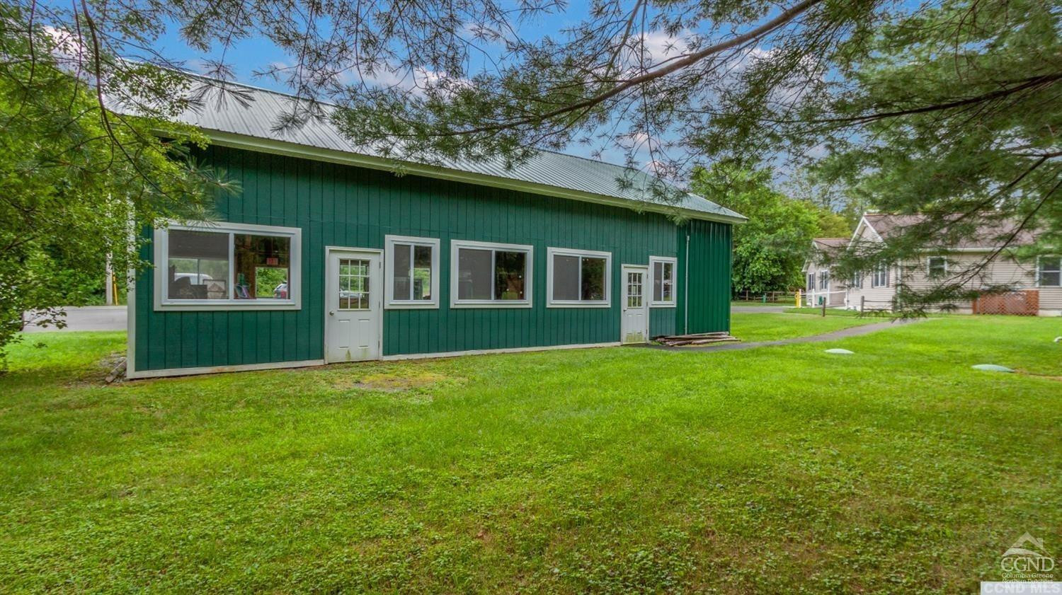 3 Cross Street Copake, NY 12516 - Photo 2 of 5 a view of a house with a backyard