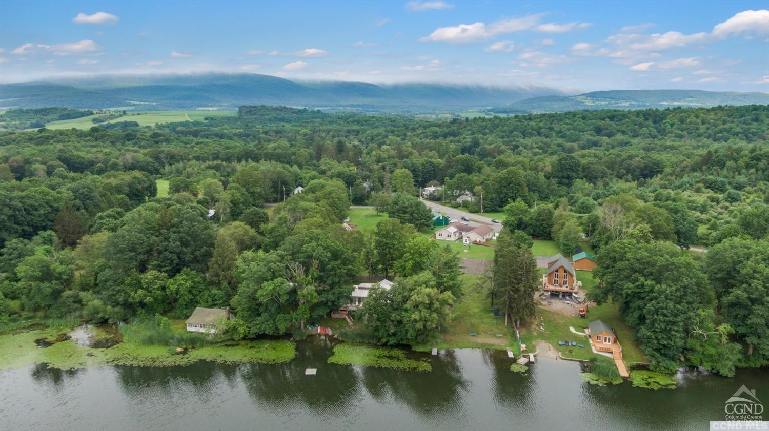 3 Cross Street Copake, NY 12516 - Photo 4 of 5 a view of a lake with green space