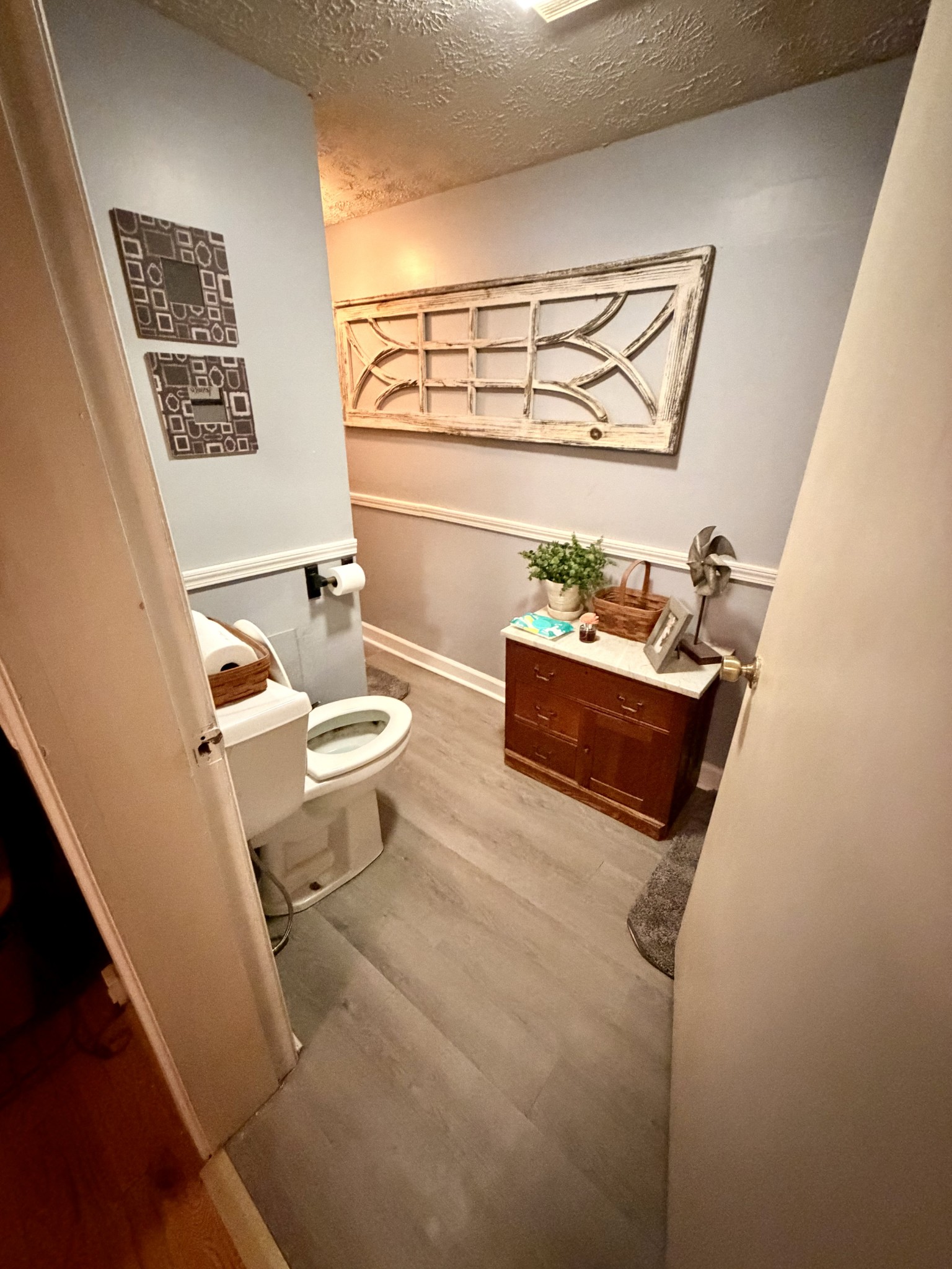 404 South Church Street Adams, TN 37010 - Photo 12 of 18 a living room with furniture and a floor to ceiling window