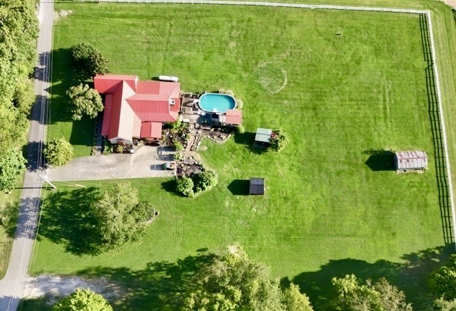 404 South Church Street Adams, TN 37010 - Photo 2 of 18 an aerial view of residential house with pool and yard