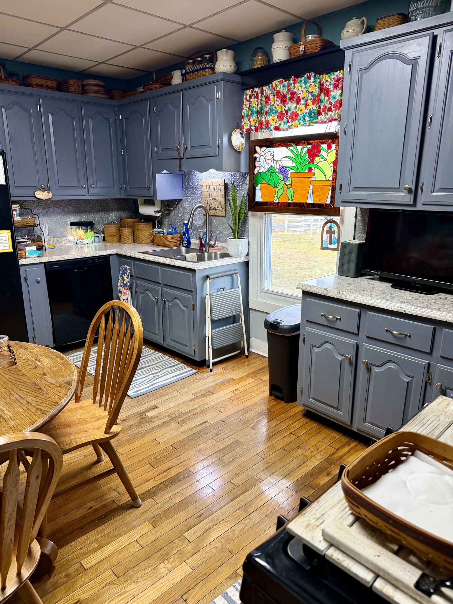 404 South Church Street Adams, TN 37010 - Photo 8 of 18 a kitchen with granite countertop a stove top oven a sink a dining table and chairs