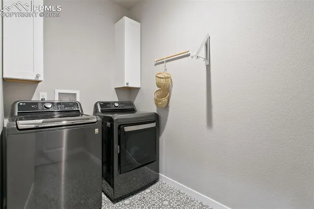 a utility room with washer and dryer