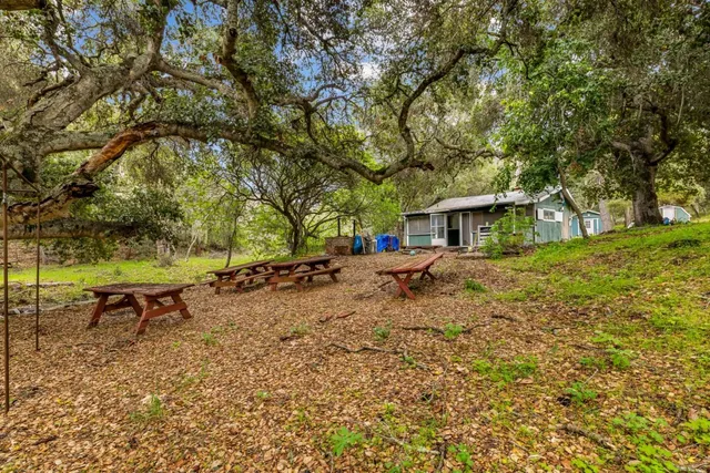 a house with swimming pool in front of it